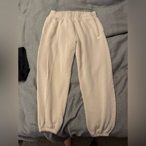 Three Nike sweatpants